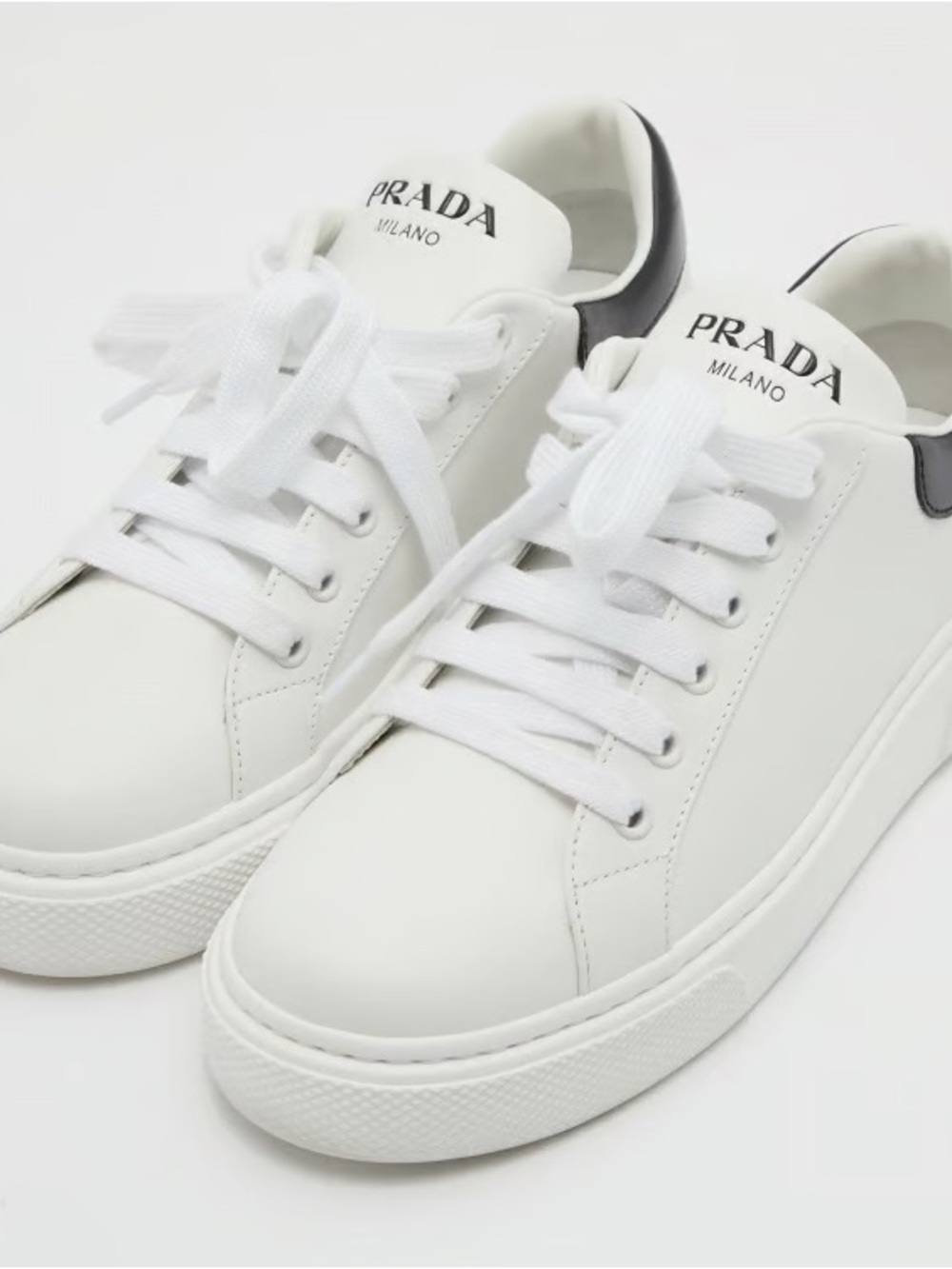 Prada White Leather Low-Top Sneakers with Black Heel Tab